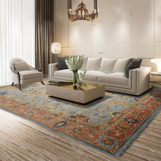 A stunning Blue and Peach Turkish Oushak hand-knotted Persian rug, made from 100% wool, featuring traditional oriental patterns that blend harmoniously across its plush surface, perfect for adding a touch of elegance to any area.